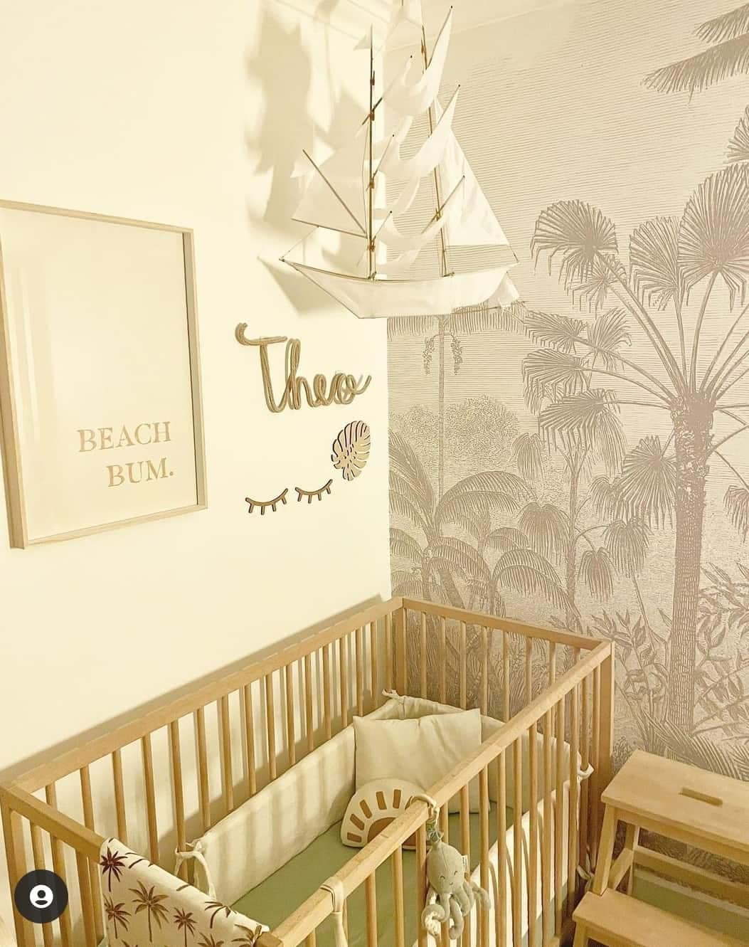 Palm tree wallpaper features lush green fronds and brown trunks on a sandy beige background.