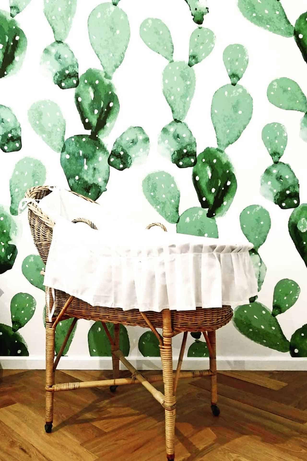 The wallpaper features a green cactus pattern in various shades, adding vibrant, multi-tonal greens to the room. The cacti are depicted in different forms and sizes, providing a lively and textured backdrop with both light and dark green hues.