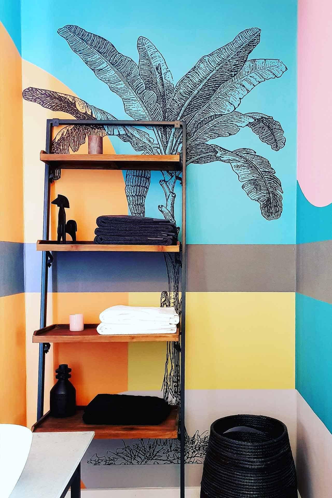 Geometric pastel patterns wallpaper with elements and colors: triangles, squares, circles; shades of mint green, blush pink, soft lavender, pastel blue, and muted yellow.