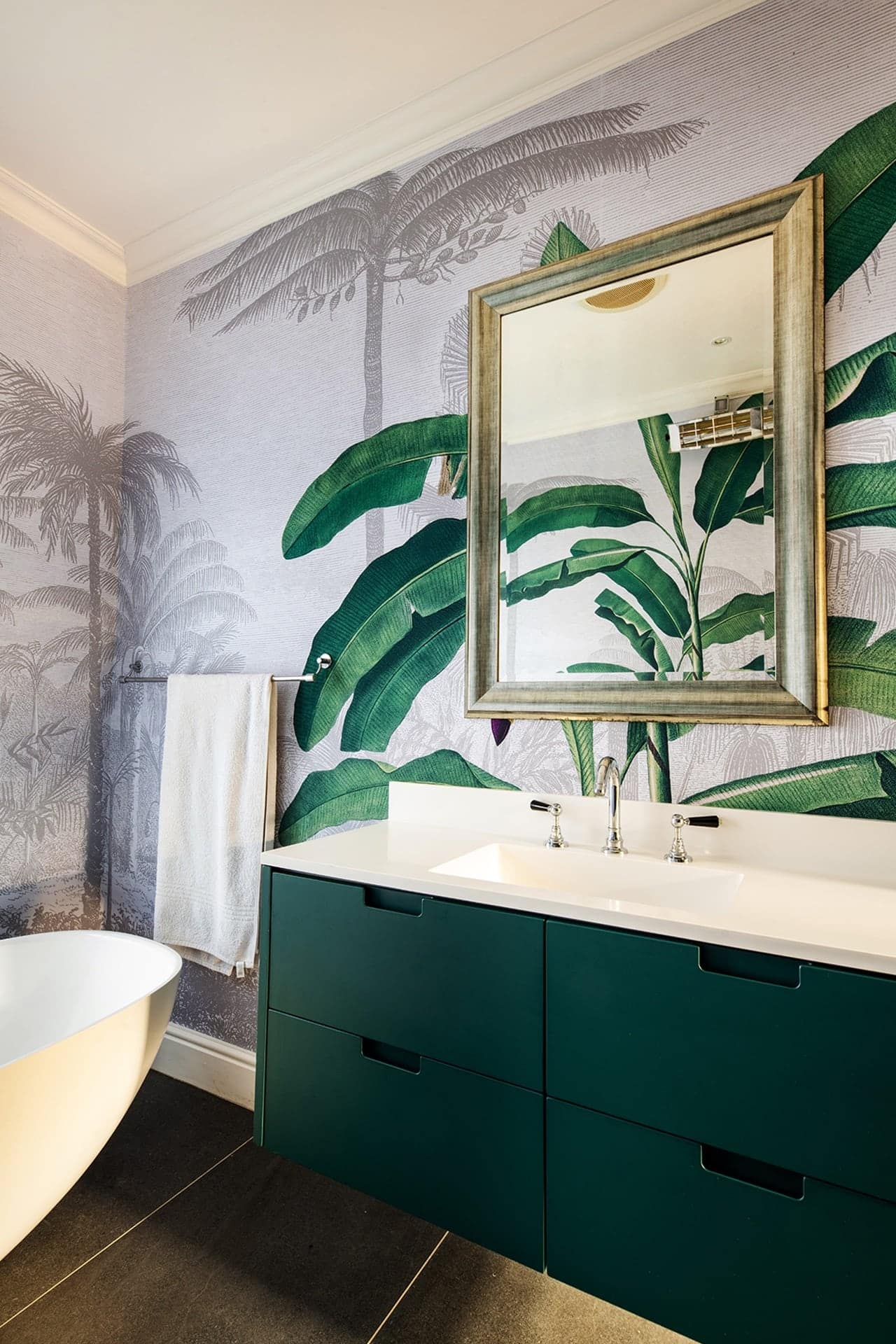 Vibrant tropical mural wallpaper featuring large banana leaves and palm trees. Rich greens, lush foliage, detailed leaf patterns. Subtle hints of yellow and deep earthy tones. Perfect for modern bathroom designs with dark green accents.