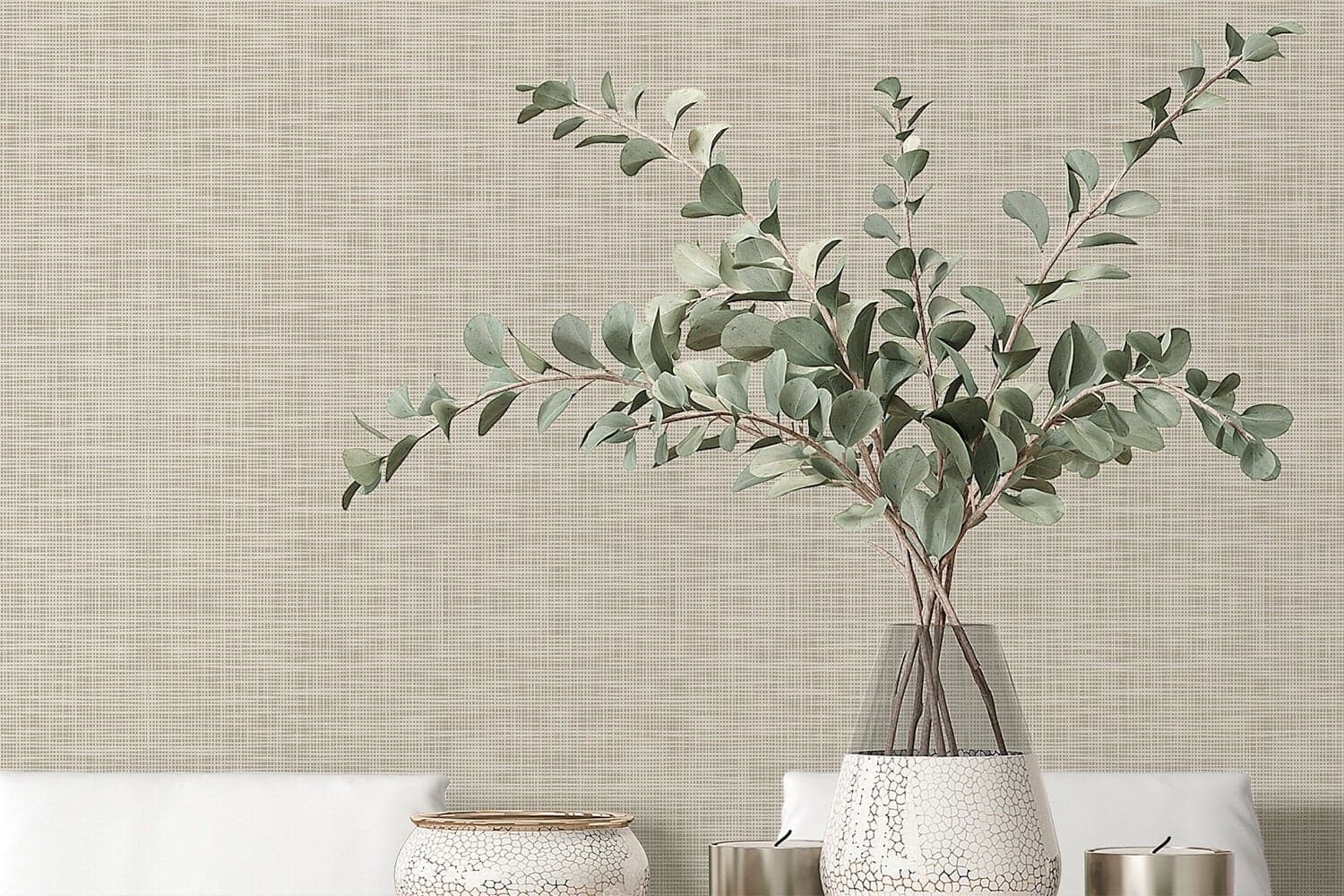 Textured beige wallpaper forms the background, featuring subtle variations in tone and a soft, modern finish.