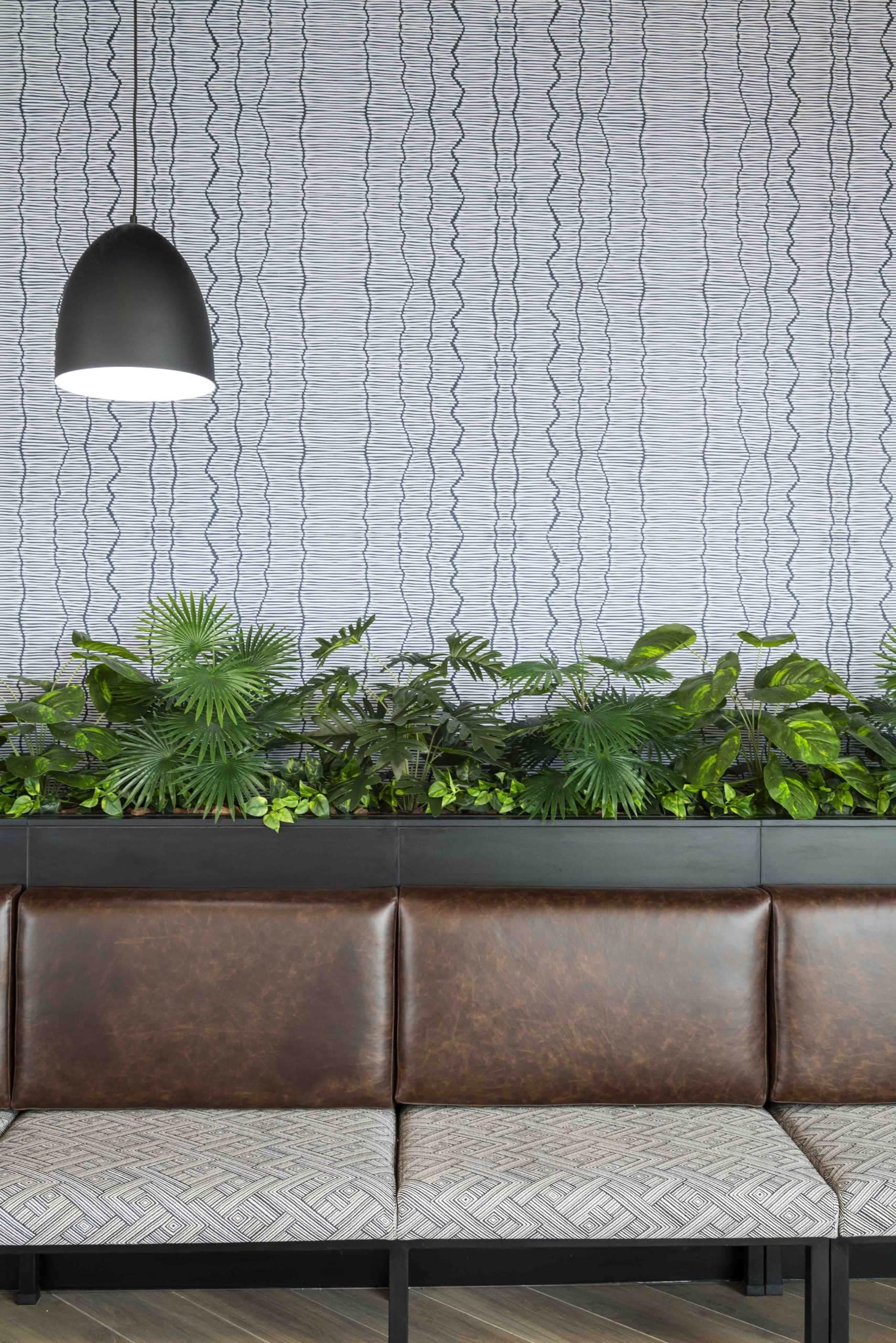 Wavy-patterned wall, featuring fluid, undulating lines with shades of gray.