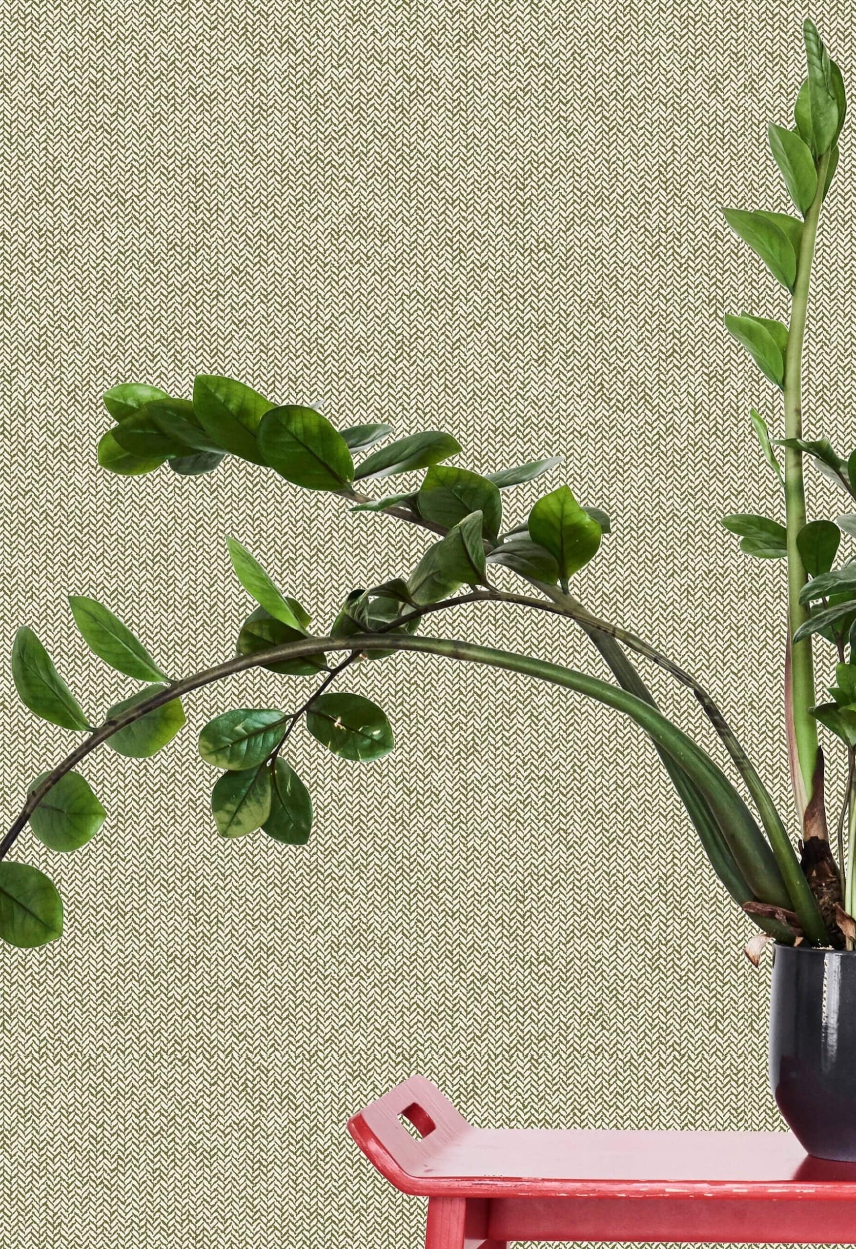 Patterned beige wallpaper with subtle decorative elements and soft neutral tones in the background.