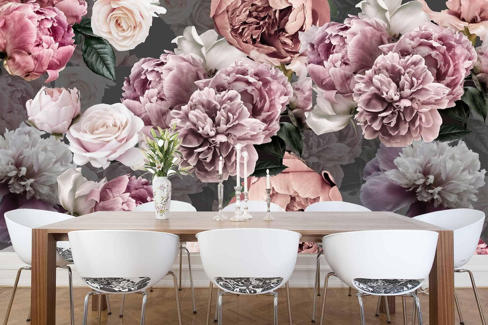 The dark backdrop features large, detailed floral wallpaper with shades of pink and white flowers.