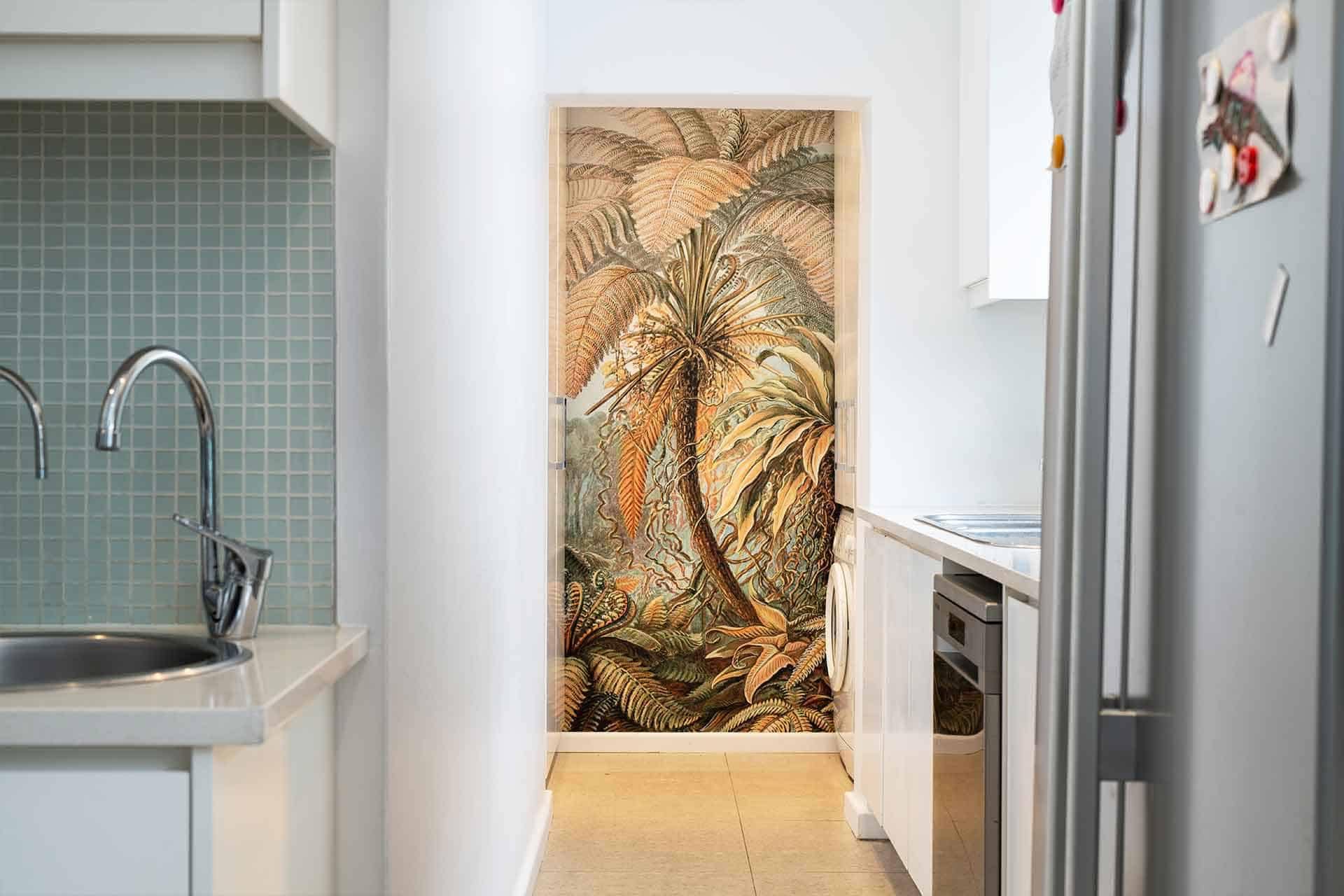 Tropical mural, vibrant wallpaper, large leaves, plants, green tones, lush foliage, tropical design.