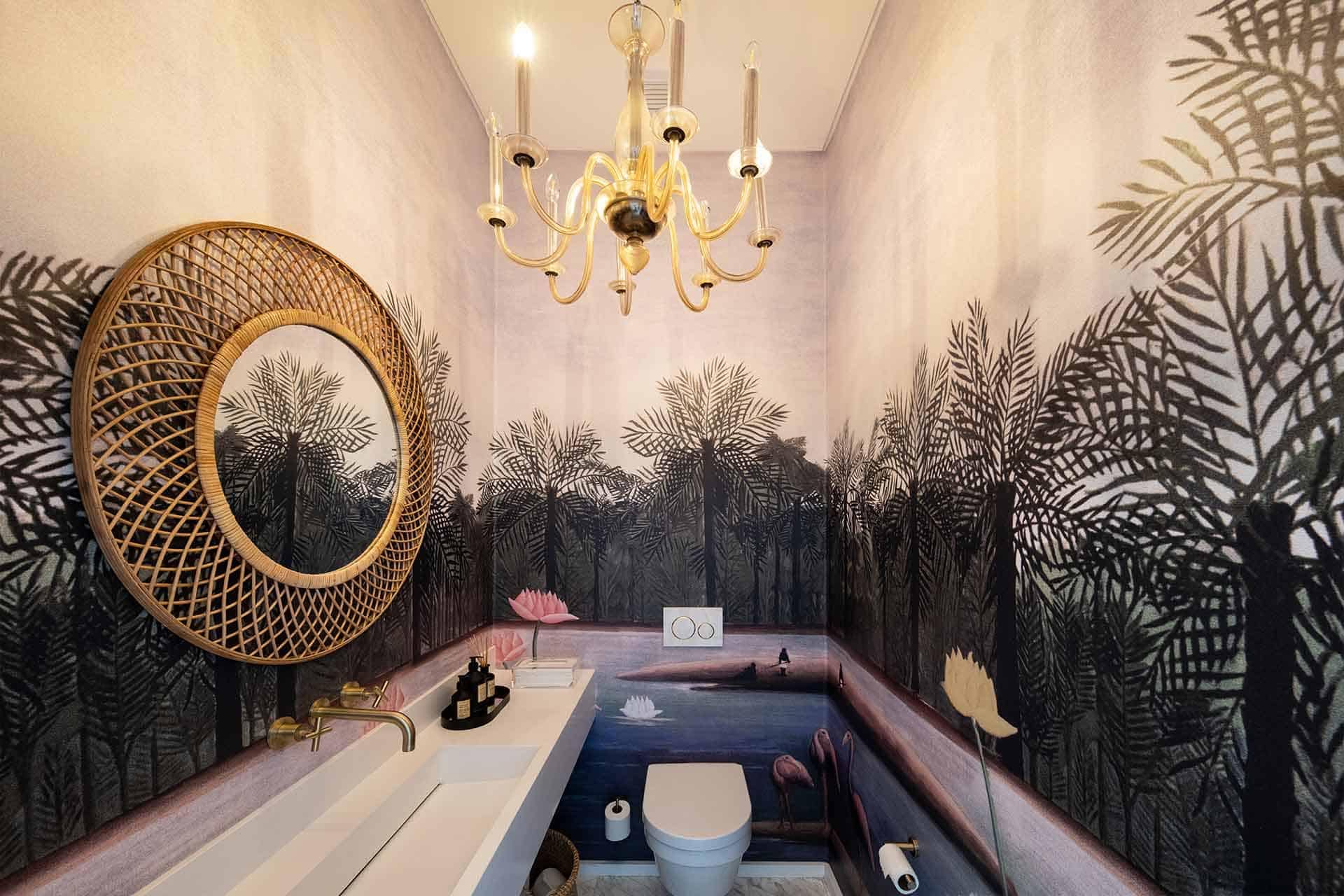 The bathroom features a striking tropical forest mural wallpaper that exudes tranquility. Lush green palm leaves, vibrant exotic flowers in shades of pink, orange, and yellow, and subtle hints of cascading vines dominate the scene. The backdrop uses deep blues and earthy tones to create depth and an immersive jungle experience. This botanical masterpiece adds a serene rainforest feel to the space.