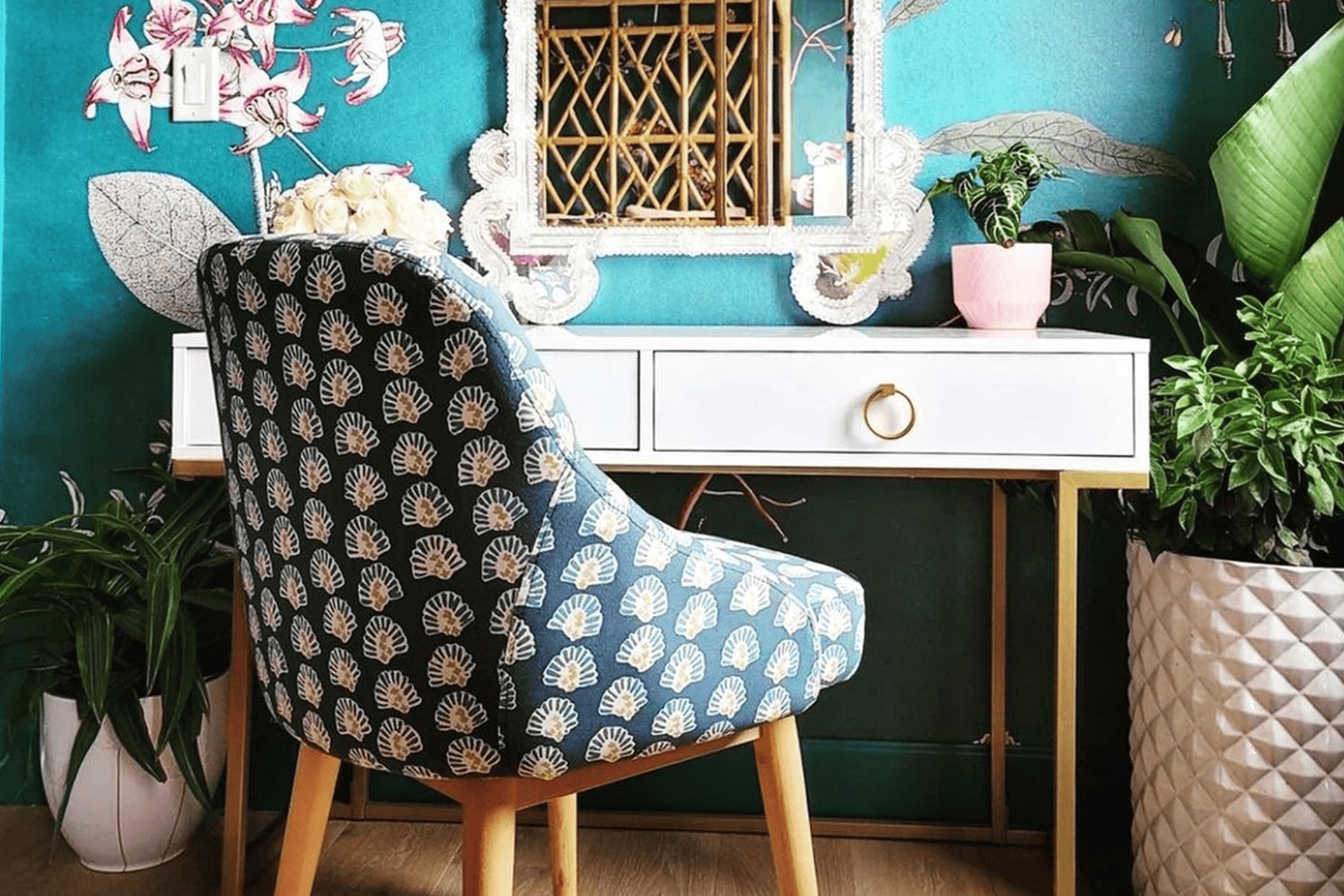 Teal wallpaper with floral designs, featuring various hues of blue and green elements.