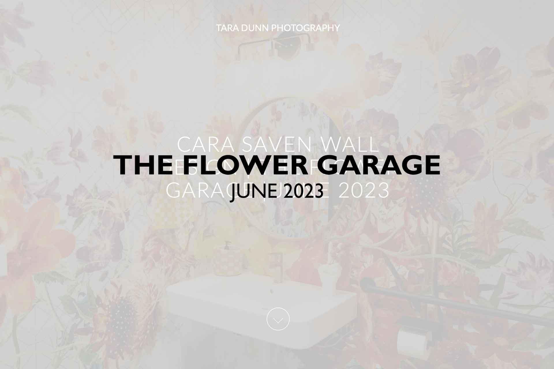 **Cara Saven Wall: The Flower Garage, June 2023**

*Tara Dunn Photography*

A vibrant floral-themed bathroom showcases stunning flower patterns on the walls, featuring bold colors and intricate designs around a highlighted sink and mirror. Elements to notice are roses, tulips, daisies in a mix of reds, yellows, purples, and blues.