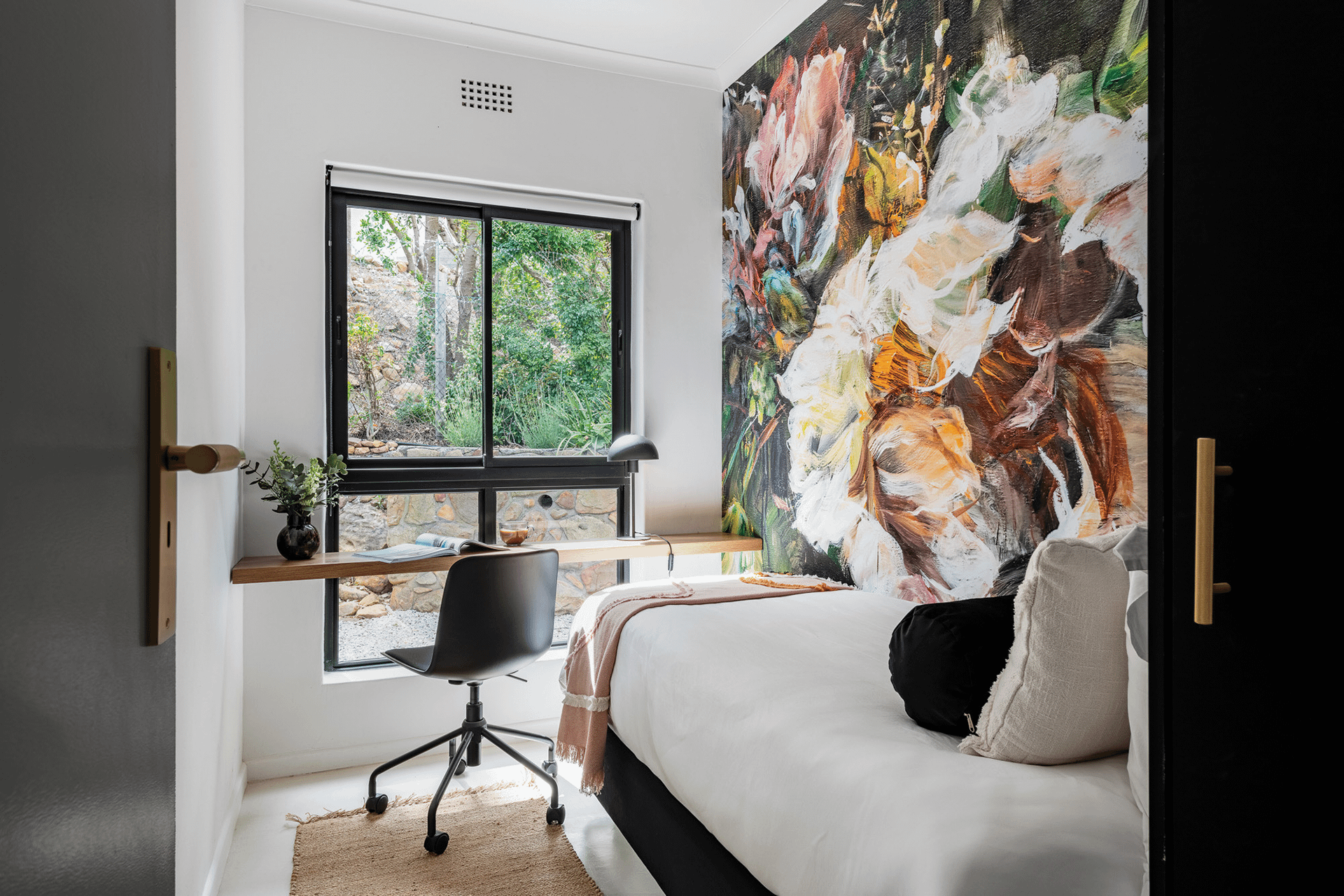 Abstract floral mural featuring bold, sweeping brushstrokes in shades of deep blue, vibrant green, and soft lavender. Delicate hints of gold and cream interlace with dynamic shapes suggesting petals and leaves. The design is layered with depth and texture, creating a sense of whimsy and tranquility.