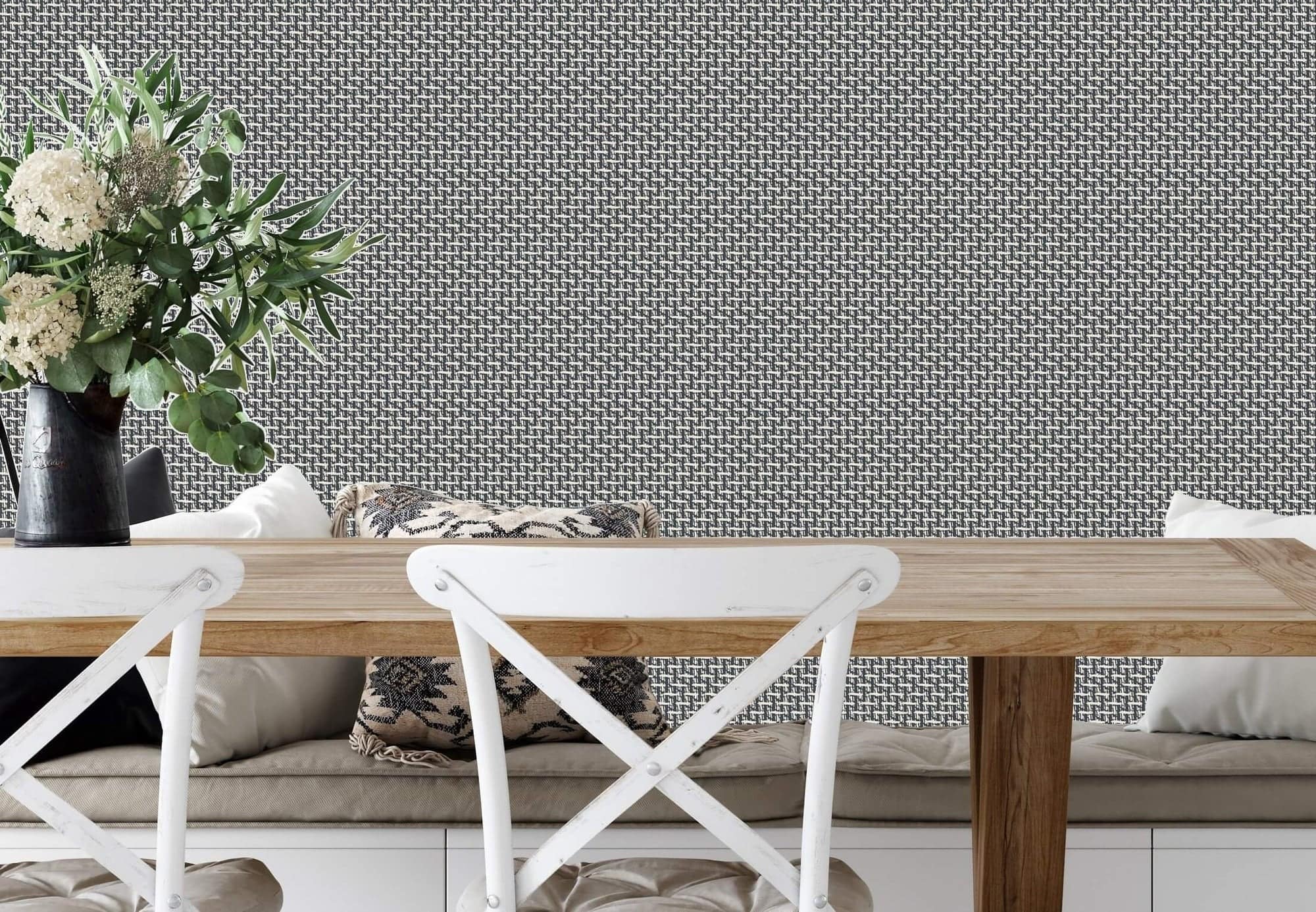Gray wallpaper with a textured, patterned design featuring subtle geometric shapes and varying shades of gray.