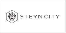 **Logo Description:**
- **Emblem:** Hexagonal shape featuring an abstract, elegant design.
- **Text:** "STEYN CITY" in uppercase letters positioned to the right of the emblem.
- **Color Scheme:** Black and white for a refined and elegant appearance.
**Wallpaper Elements:**
- Hexagonal pattern
- Abstract designs
- Black and white contrast
The emphasis on these elements ensures the logo exudes a sophisticated allure, akin to a dream home-themed carousel ride.