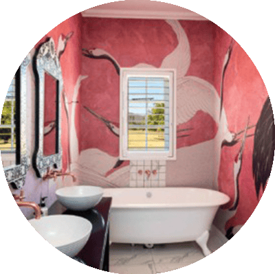 Elaborate mural wallpaper features white cranes on a red background.