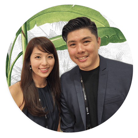 Backdrop featuring large green leaves, creating an atmosphere of natural beauty. Elements: Large leaves, greenery, lush foliage. Colors: various shades of green.