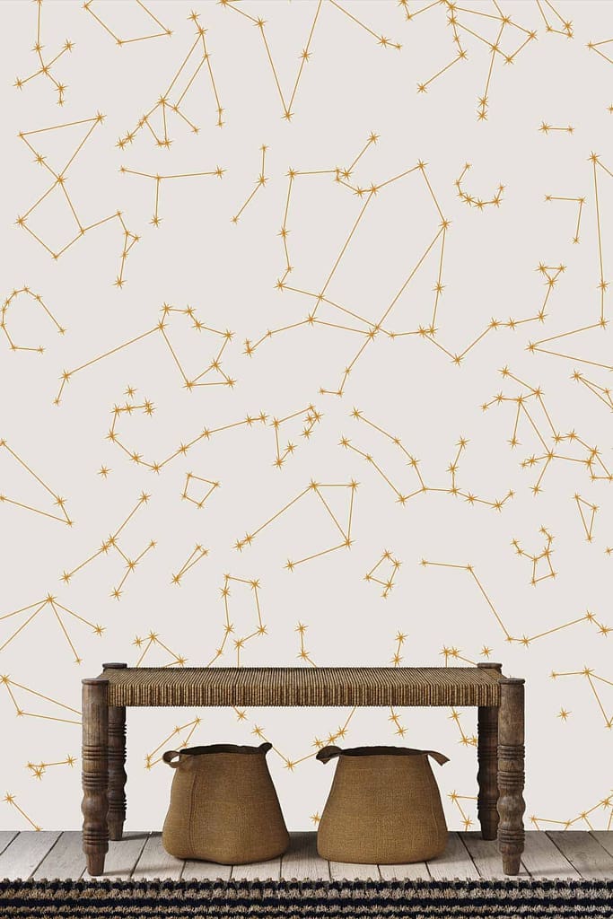 Wallpaper features: golden constellation patterns, white background.