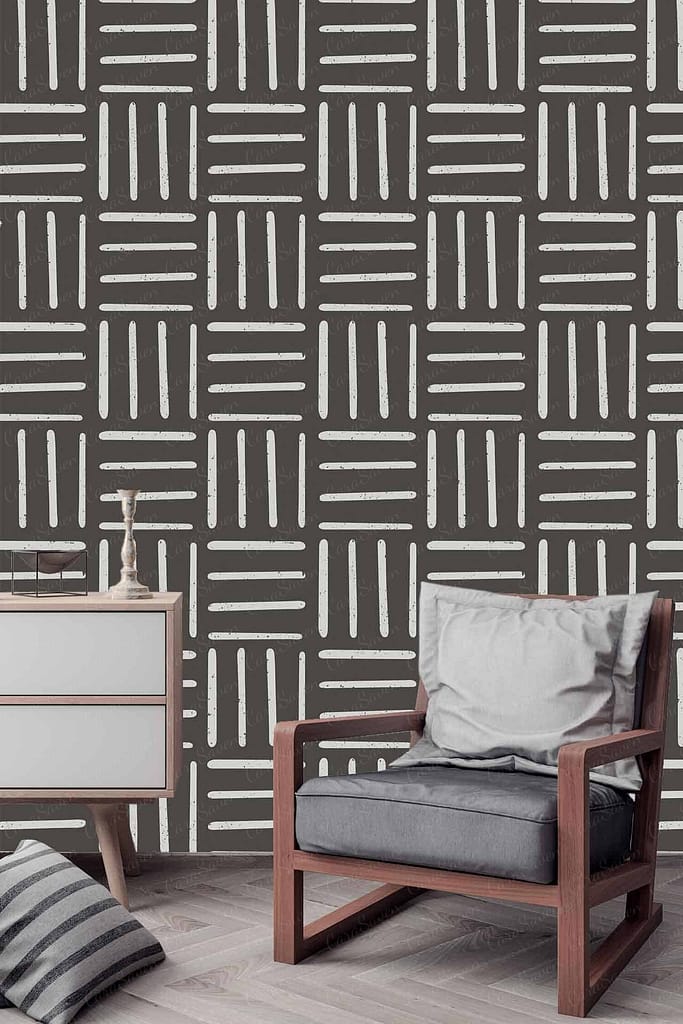 The wallpaper features a geometric pattern with intersecting horizontal and vertical lines, creating a structured grid-like design. Predominantly neutral in color, it uses shades of grey and white to achieve a modern aesthetic. This sophisticated pattern serves as an elegant backdrop for the room's decor.