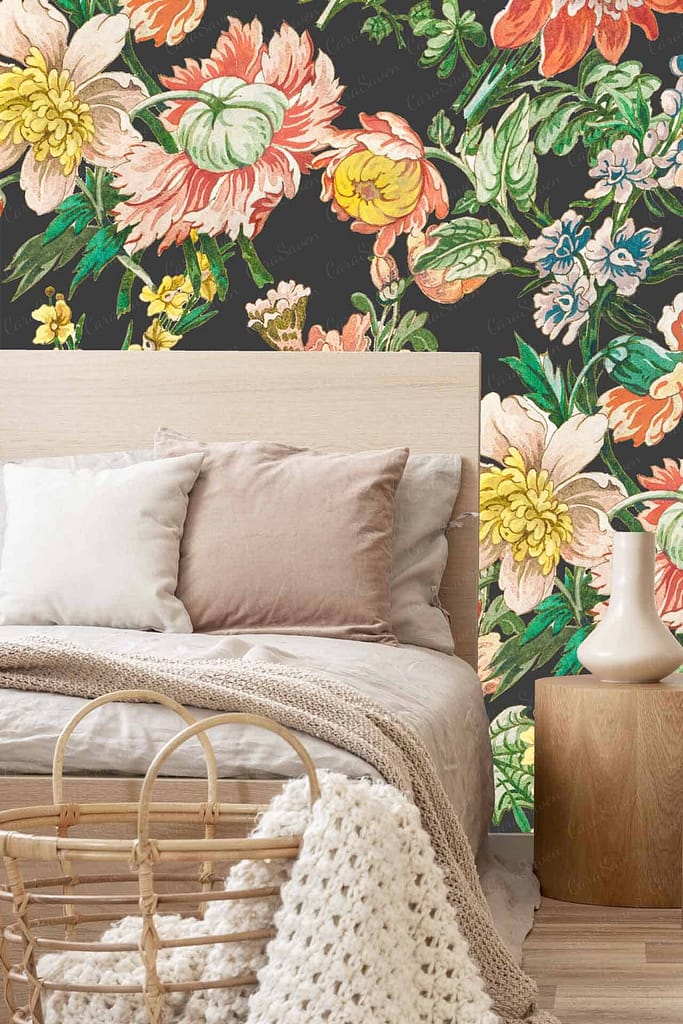 Granny's Floral wallpaper features a vibrant display of multi-colored flowers. The design includes roses, tulips, daisies, and peonies in hues of red, pink, yellow, and blue. Lush green leaves and subtle vine patterns enhance the floral motif against a soft cream background.