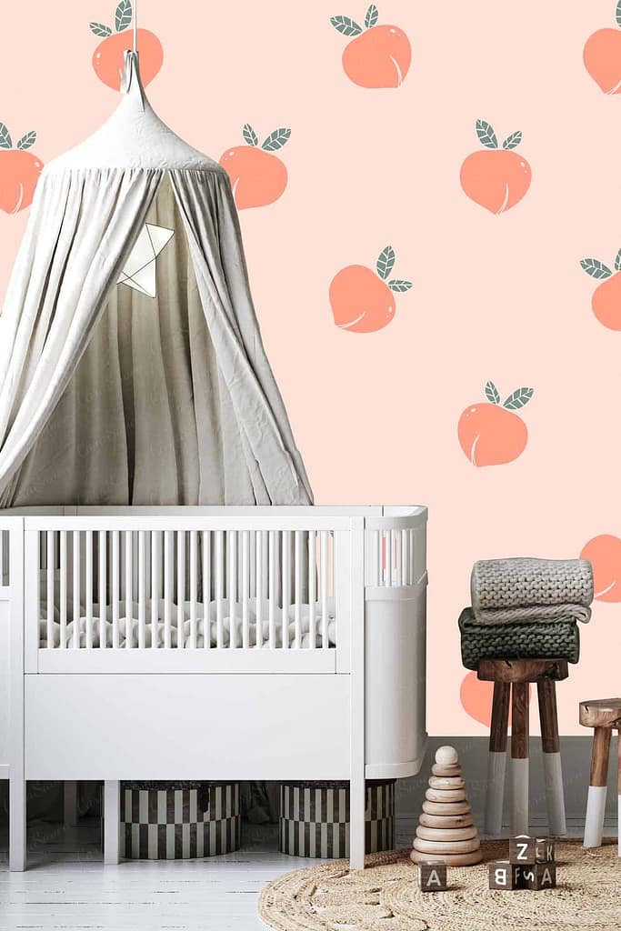 The wallpaper in the cozy "Little Peach" nursery features a charming peach theme. Colorful, ripe peaches with blush tones are scattered against a backdrop of soft pastel hues. Delicate green leaves accentuate the vibrant fruit, adding a touch of nature and freshness to the room's decor.
