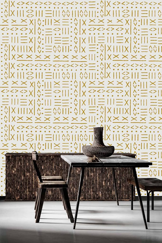 The wallpaper in the modern dining area features geometric shapes in gold on a white background. The design elements include various geometric patterns, sharply defined in metallic gold, contrasting elegantly against the crisp white backdrop. This contemporary and stylish wallpaper creates a striking visual impact with its clean lines and sophisticated color palette of gold and white.
