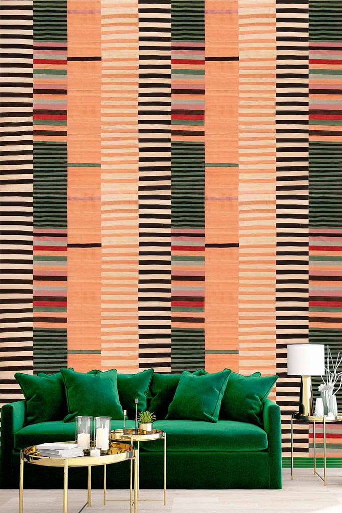 Striking geometric wallpaper features alternating vertical stripes in shades of peach, green, black, and red.