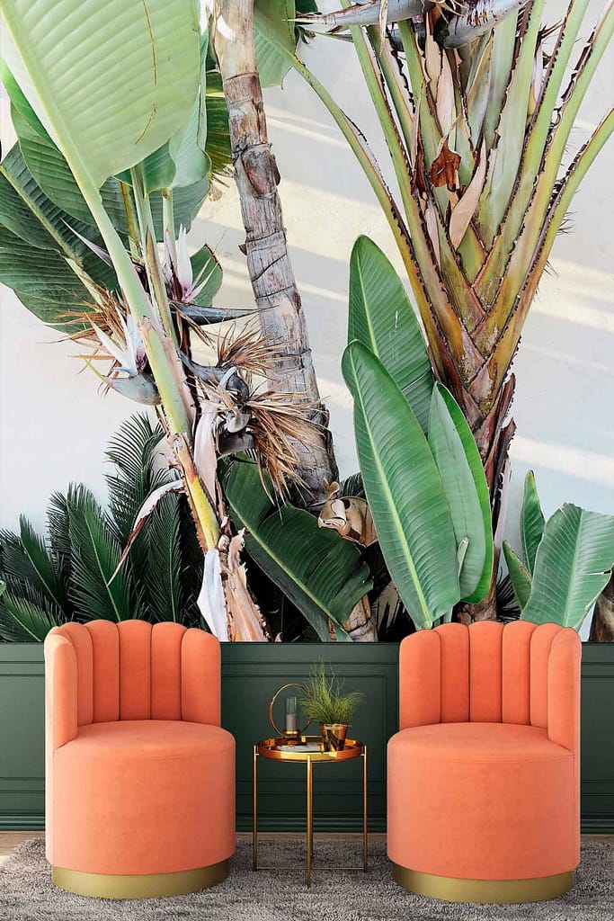 The wallpaper features a large, vibrant mural of tropical plants evoking a Balinese summer. Elements include lush green leaves, exotic flowers in vivid shades of red, orange, and yellow, intertwined vines, and possibly elements of water or sky in subtle blues.