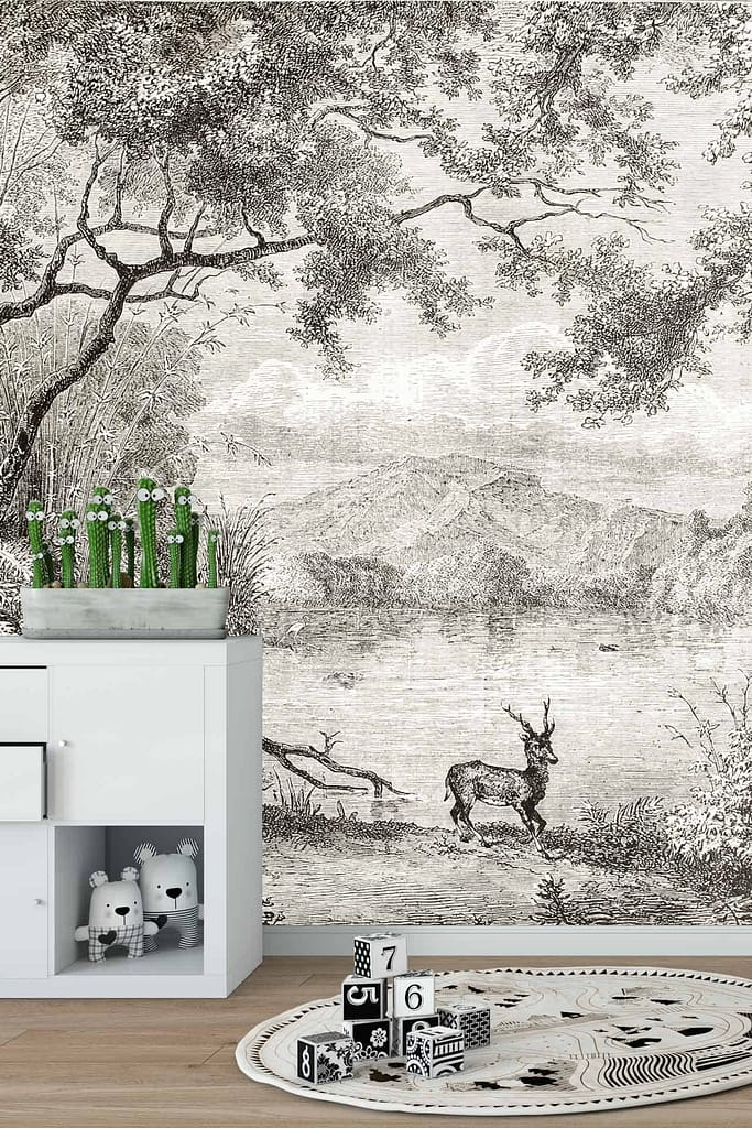 Monochrome wall mural shows serene landscape: trees, mountains, deer near lake. Design evokes Balmoral's natural beauty with grayscale shades.