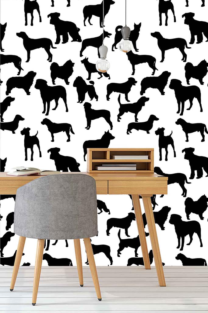 The wallpaper features black and white designs with various dog silhouettes. The playful pattern adds a unique touch to the minimalist decor, making it a standout element in the workspace.