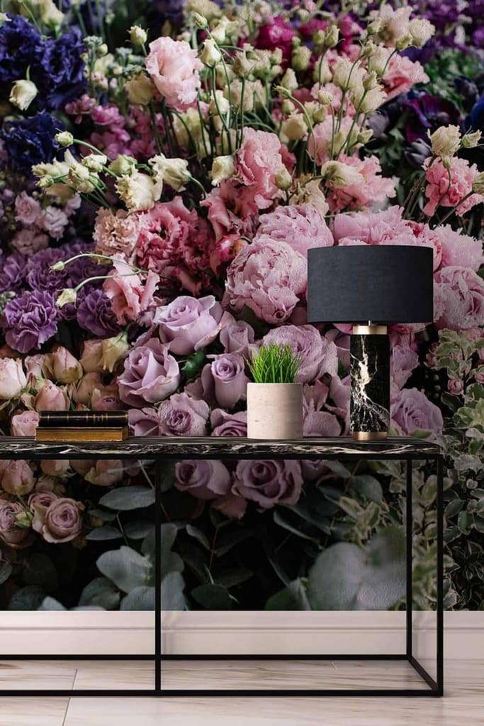 A breathtaking wall mural showcases blooming flowers in shades of pink, purple, and white. The vibrant floral design offers a rich tapestry of color, creating an eye-catching feature ideal for adding life to any room.
