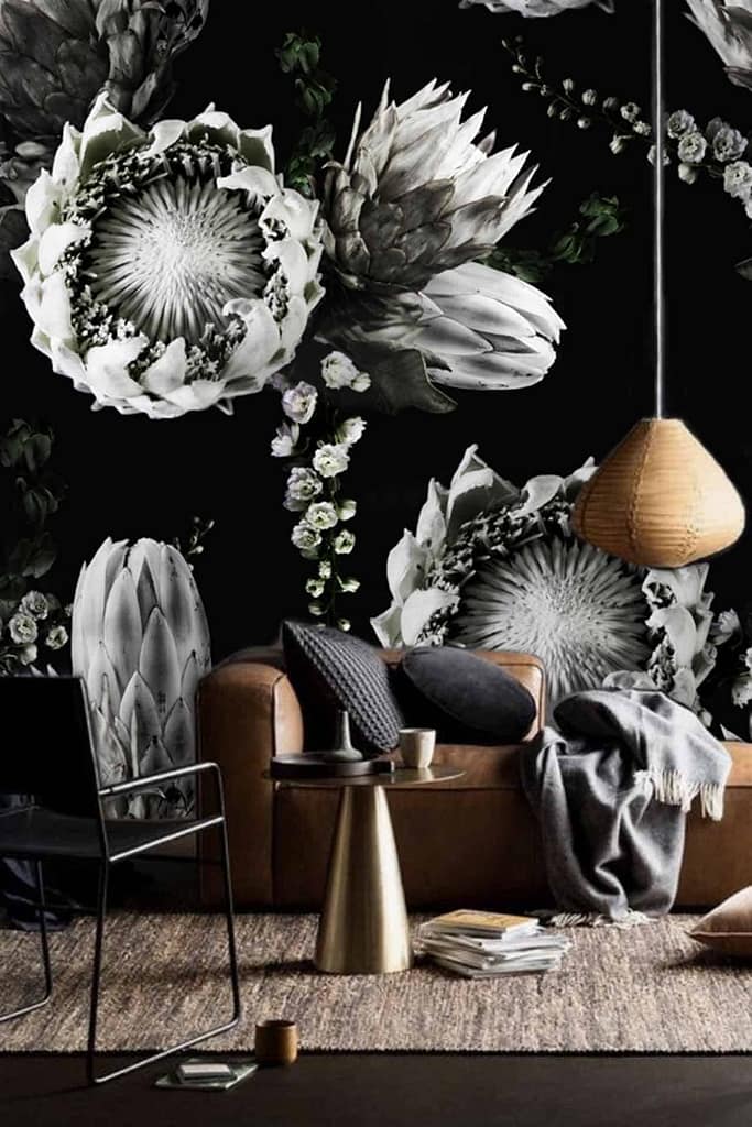The Caro dark floral wallpaper features large, detailed flowers in black, white, and grey tones.