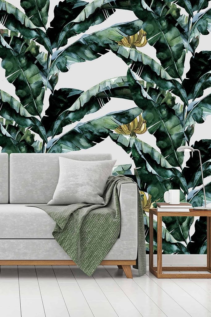 Vibrant tropical leaf wallpaper featuring lush green palm fronds, rich emerald banana leaves, and delicate ferns in various shades of green. Splashes of deep blue and bright yellow accents interspersed throughout for added vibrancy. The background is subtly textured with off-white hues, creating depth and contrast among the leafy elements.