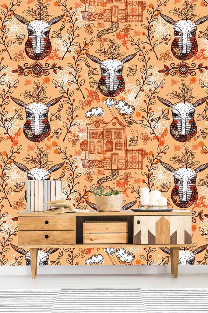 The wallpaper in the room features patterns with earthy tones, including drawings of goat heads, flowers, and houses.