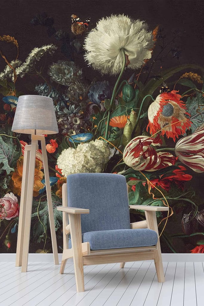 The wallpaper features a vivid, large-scale floral painting with a variety of colorful flowers. Prominent colors include bright reds, deep blues, sunny yellows, rich purples, and lush greens. The intricate design exudes a classic and artistic ambiance reminiscent of Downton Abbey's opulent settings.