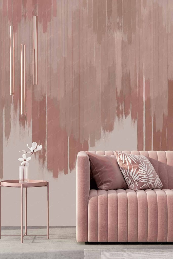 The wallpaper features a gradient backdrop with vertical brushstroke-like patterns. It showcases shades of pink and beige, creating a soft, modern aesthetic perfect for stylish living spaces.