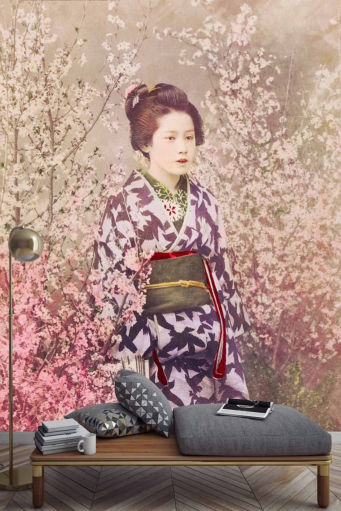 Vintage image of Japanese Geisha in traditional kimono, blooming cherry blossoms, serene setting, vibrant pink and white flowers, modern floor lamp, low seating area with cushions.