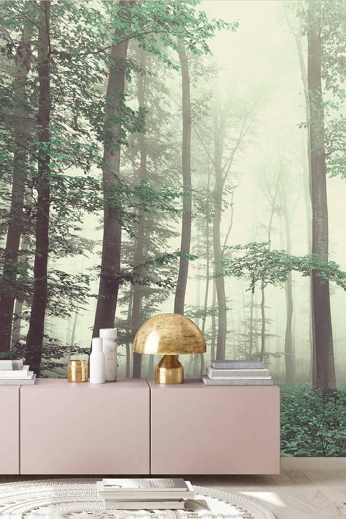 The wallpaper features a misty forest scene, with varying shades of green and gray capturing the ethereal quality of morning fog. Delicate tree silhouettes emerge through the mist, offering a serene and tranquil atmosphere to the room.