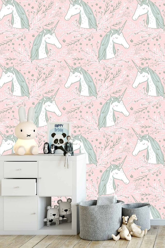 The children's room features a pink wall adorned with unicorn wallpaper. The wallpaper showcases whimsical unicorns in pastel colors like lavender, mint green, and soft yellow. Stars and rainbows in matching hues add a magical touch to the scene, making it idyllic for unicorn-loving friends.