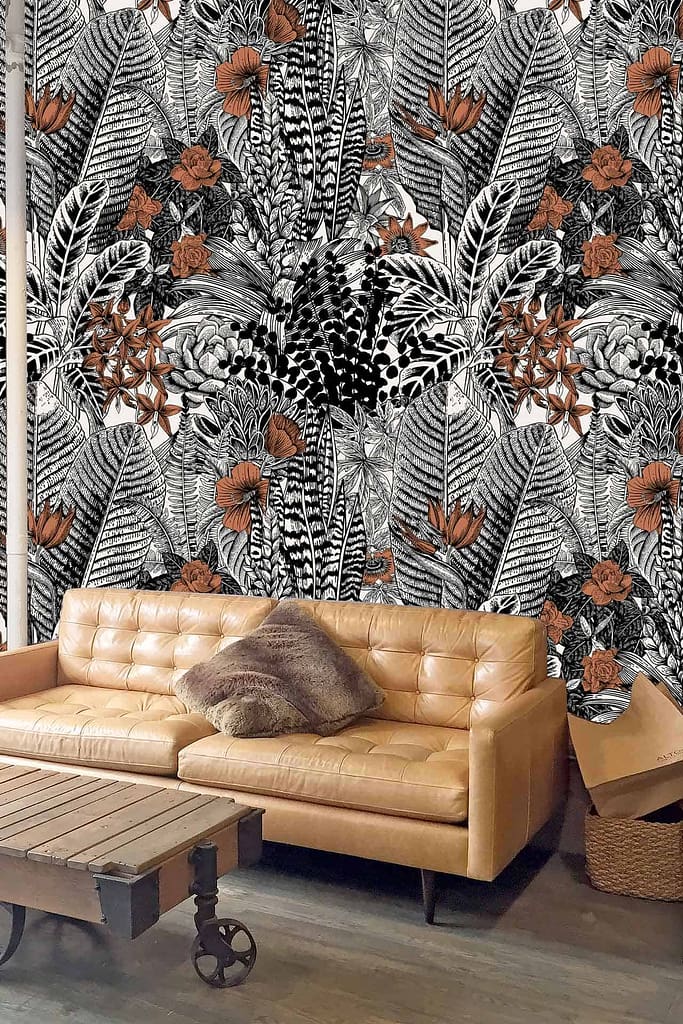Vibrant nature-themed wallpaper with intricate black and white leaves and orange flowers.