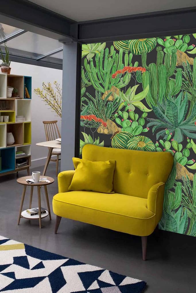 The wallpaper is vibrant and desert-themed, featuring various green cacti and red flowers.