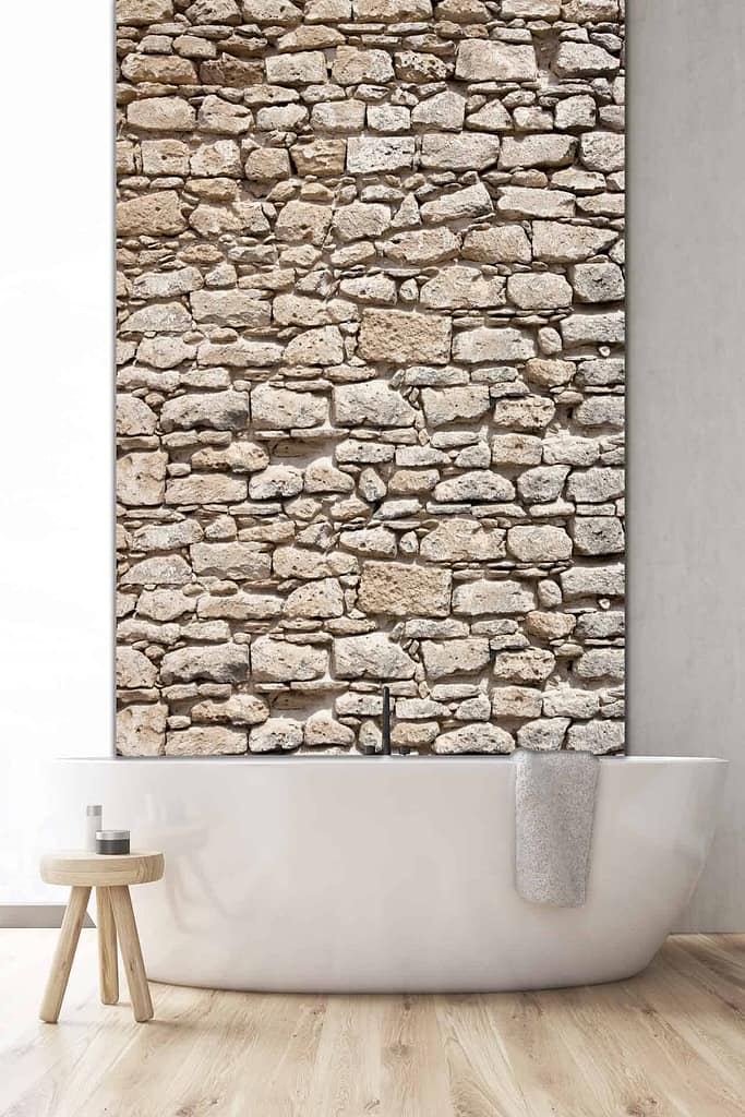 The wallpaper features a wall-length rough stone design, evoking the rustic charm of Rhodes Island with its earthy tones and textured appearance.