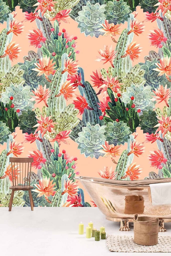 The wallpaper features a vibrant, floral design with a variety of succulents and cactus plants adorned with orange and pink flowers. Delicate roses interspersed throughout add elegance, creating a lush botanical tapestry filled with rich greens, soft hues of pinks, and striking oranges.