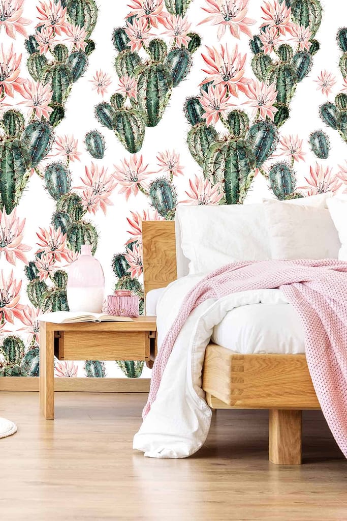 Vibrant wallpaper featuring green cacti and pink flowers, adding a lively touch to the room.