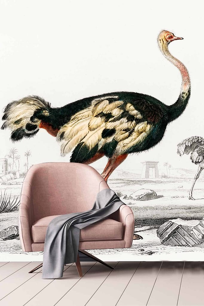 A stylish room features a vintage mural of an ostrich set against an ancient ruins landscape. The wallpaper showcases detailed ostrich feathers, crumbling stone structures, and shades of sepia, beige, and subtle greens. Touches of earthy tones highlight the nostalgic feel.