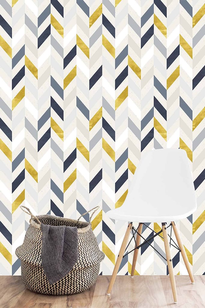 The wallpaper features a captivating herringbone pattern in shades of grey, white, navy, and gold. The intricate design adds visual depth and sophistication to the space. The elegant color palette complements mid-century modern aesthetics and enhances the allure of the room.