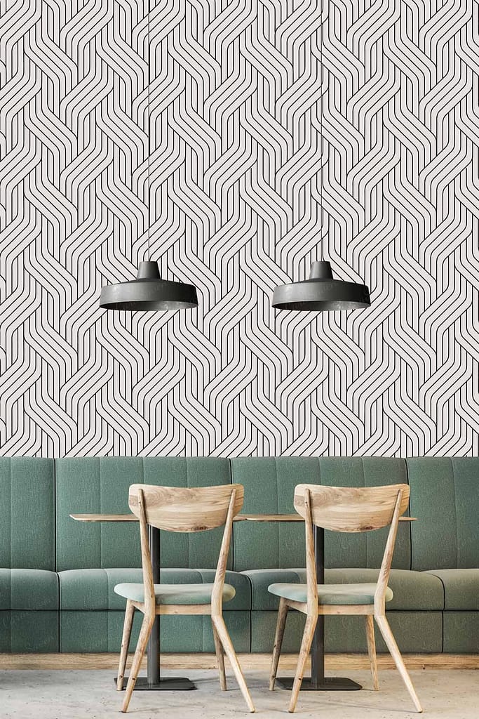 The Road Less Travelled" inspired wallpaper features an intricate black and white geometric pattern, with elements of sharp lines, angles, and symmetrical shapes. The design creates a striking contrast with its monochrome palette, enhancing modern sophistication in the space.