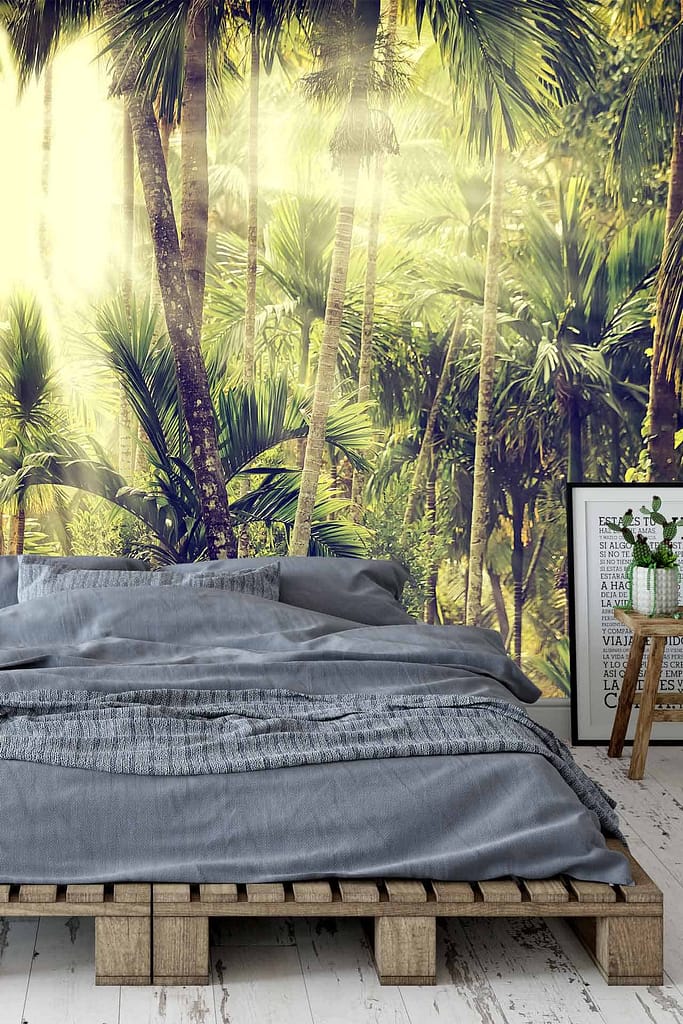 A vibrant tropical forest mural dominates the wall, featuring lush green foliage, towering palm fronds, and vibrant flora. Hues of deep emerald, jade, and splashes of bright tropical blooms such as hibiscus and bird-of-paradise enhance the mural’s exotic charm. Soft sunlight filters through tall trees and dense plants depicted in rich greens and earthy tones.