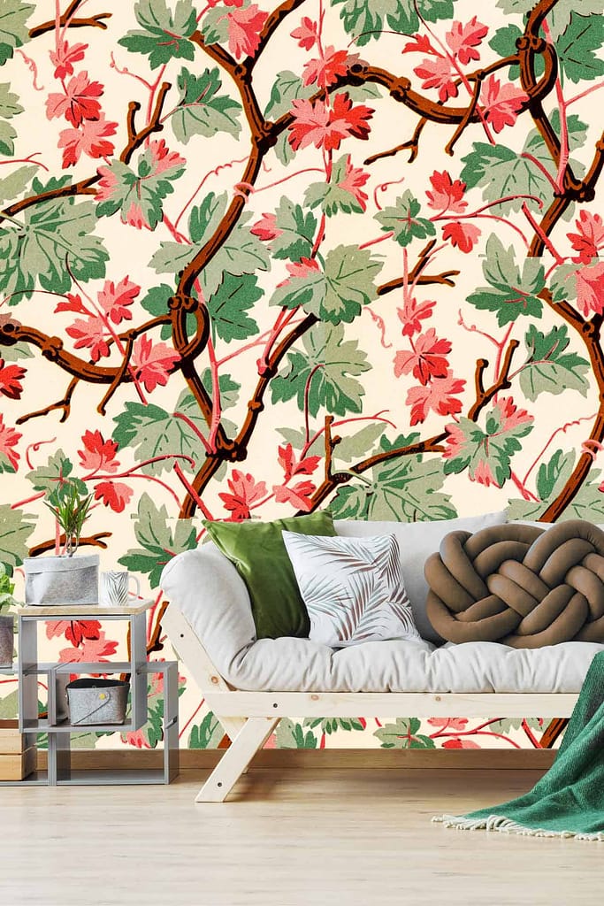 The wallpaper features vibrant red and green leaves on intertwining vines, adding a lively and natural touch to the room's ambiance.