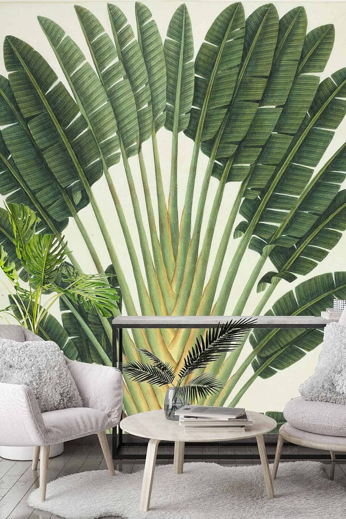 A large wall mural depicting a lush, green fan of banana leaves with vibrant shades of emerald and forest green. Subtle Voodoo elements are interwoven within the design, featuring intricate patterns in dark purples and mystical symbols seamlessly blending into the foliage. The tropical motif is bathed in warm, natural tones that enhance the relaxing yet mysterious atmosphere.