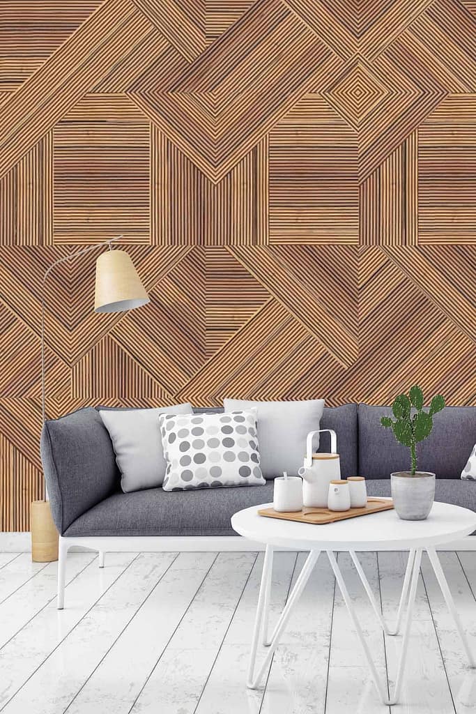 The modern living room features a stunning geometric wooden patterned wall. This wallpaper boasts intricate details with various shades of brown and beige, creating an eye-catching contrast and texture. The wooden patterns incorporate triangular and diamond shapes, adding a contemporary flair to the space. The rich, warm tones in the geometric design perfectly complement the muted elegance of the gray sofa and stylish room decor.