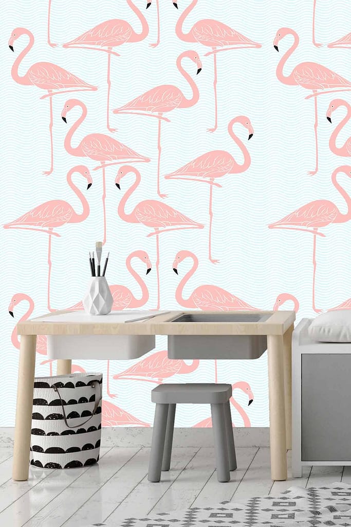 The wallpaper in the children's room features a West Coast vibe and displays standing pink flamingos on a light blue background.