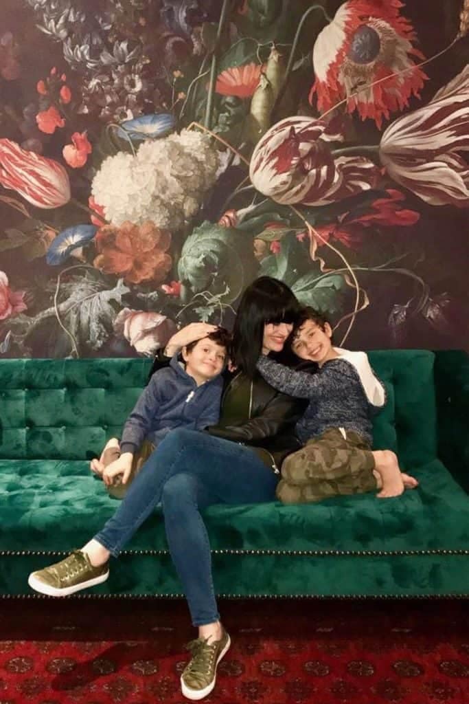 Colorful floral mural with vivid hues of pink, red, yellow, blue, and green. Includes intricate patterns of blooming flowers and lush foliage. Perfect backdrop for a vibrant, cheerful setting.