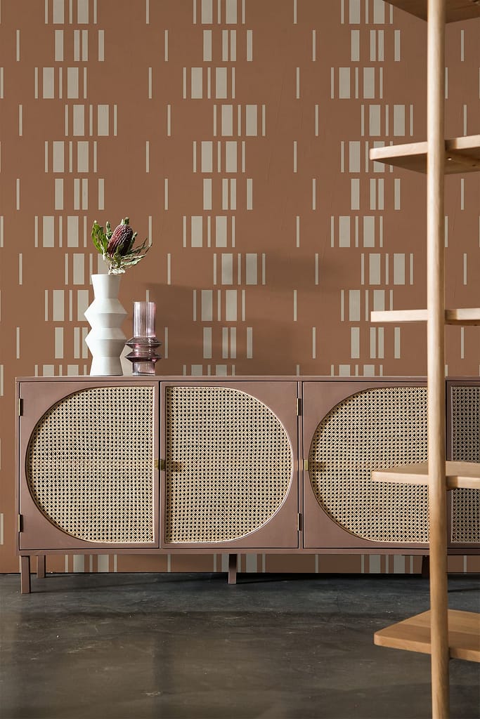 Geometric-patterned wallpaper featuring shades of brown and beige, reminiscent of a tortoise shell design.